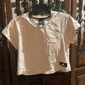 Adidas cropped t-shirt. More of a cream color with black accents.